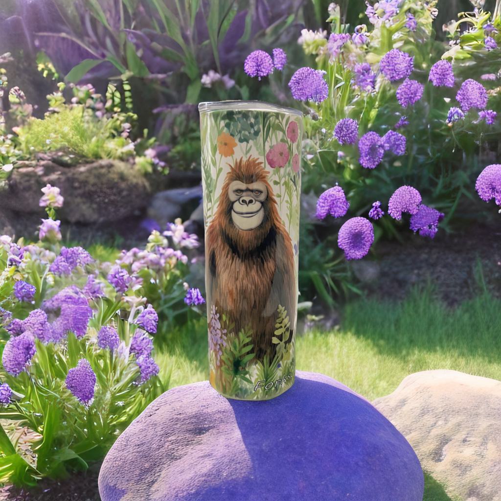 Girl Sasquatch Bigfoot in a meadow of flowers Tumbler Water Bottle
